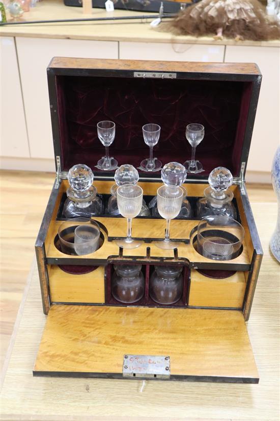 A Victorian burr walnut cased decanter and drinking glass set, some of the glass matched, 40cm wide